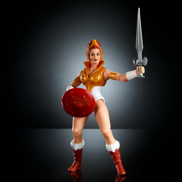 Jucărie Masters of the Universe Origins, figurină Teela din colecția de desene animate, aproximativ 14 cm înălțime Eroina Motu, accesoriu și mini benzi desenate, HYD27
