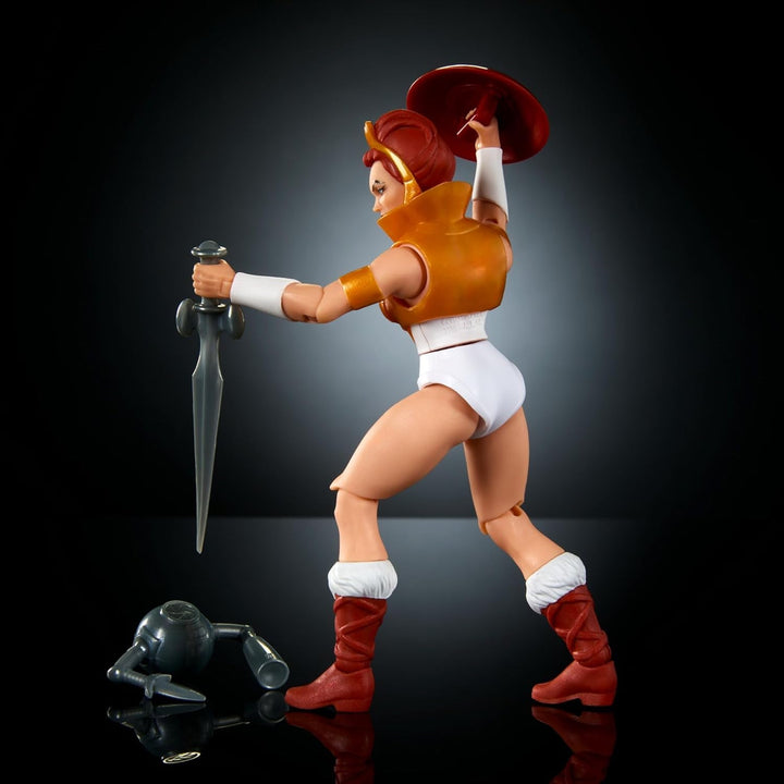 Jucărie Masters of the Universe Origins, figurină Teela din colecția de desene animate, aproximativ 14 cm înălțime Eroina Motu, accesoriu și mini benzi desenate, HYD27