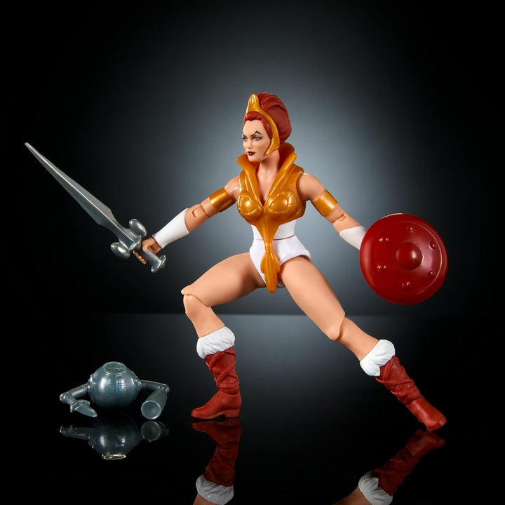 Jucărie Masters of the Universe Origins, figurină Teela din colecția de desene animate, aproximativ 14 cm înălțime Eroina Motu, accesoriu și mini benzi desenate, HYD27